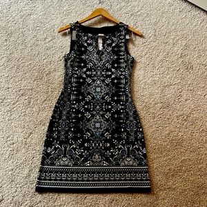 White House Black Market. Elegant Black dress with beaded detail. Brand new.